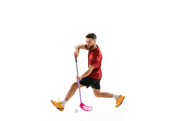 floorball male player with floorball stick training isolated on white studio background. sport, action and motion, movement, healthy lifestyle - teamsport imagens e fotografias de stock