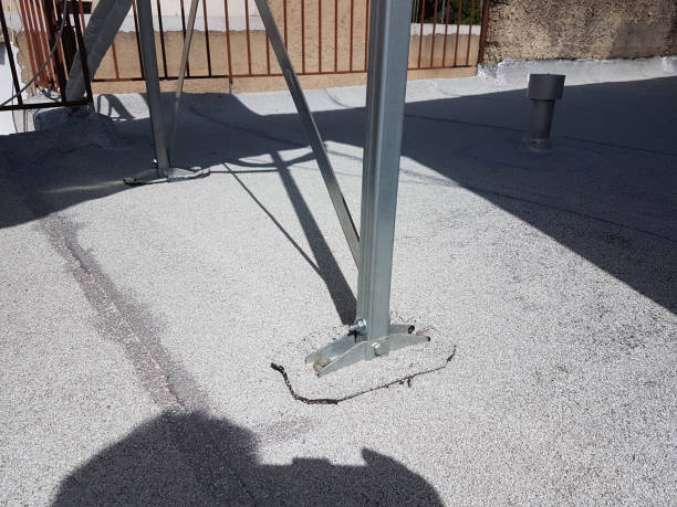 istock roof insulation on solar heater base feet installation, 1409480081