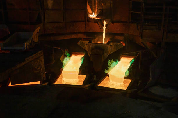 istock Process of pouring liquid hot copper into molds. 1409483061