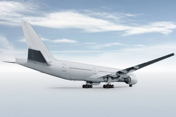 istock White wide body passenger airliner isolated on bright background with sky 1409486070