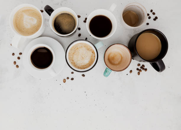 top view on flat lay with many different full and empty coffee cups on concrete - mug shot imagens e fotografias de stock