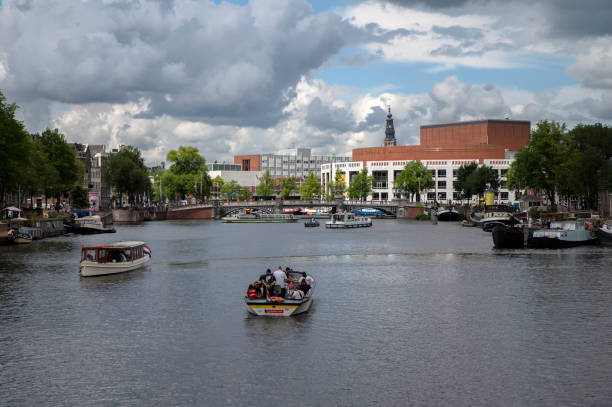 Stopera Building In The Background At Amsterdam The Netherlands Stopera Building In The Background At Amsterdam The Netherlands 5-7-2022 stopera stock pictures, royalty-free photos & images