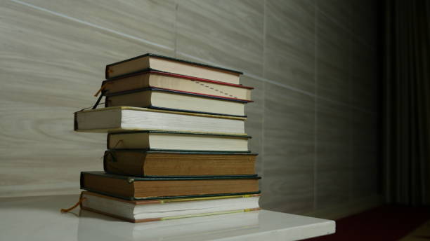 istock A collection of books piled on the table 1409489151