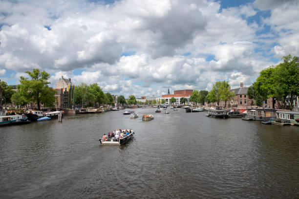 View From The Magere Brug At Amsterdam The Netherlands View From The Magere Brug At Amsterdam The Netherlands 5-7-2022 stopera stock pictures, royalty-free photos & images