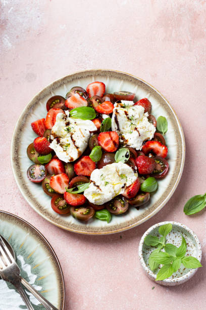 istock Salad with mozzarella, strawberries and cherry tomatoes 1409492333