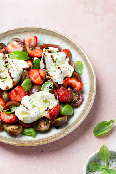 istock Salad with mozzarella, strawberries and cherry tomatoes 1409492352