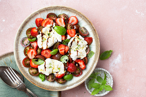 Caprese Salad with mozzarella, strawberries and cherry tomatoes
