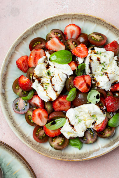 istock Salad with mozzarella, strawberries and cherry tomatoes 1409492367