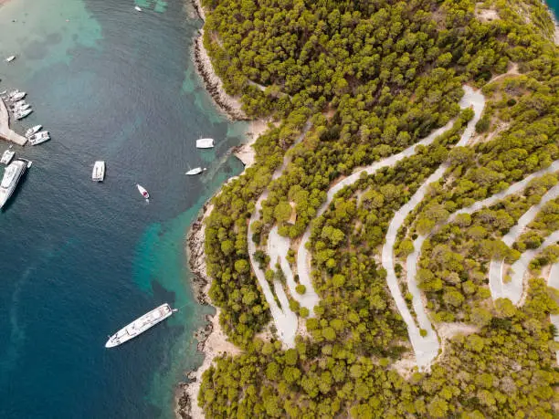 Photo of aerial shot drone of road with may curves in cephalonia island,greece