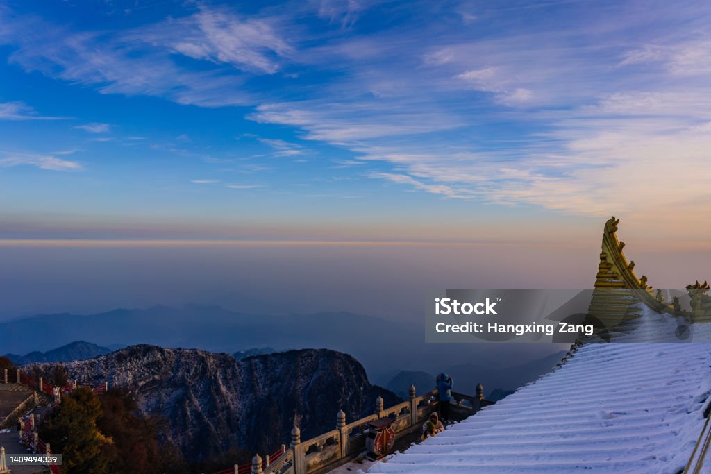 The eaves of the Jingding temple at Mount Emei Frost-covered eaves and the sea of cloud. Architecture Stock Photo