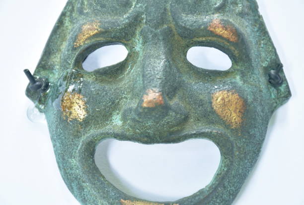 istock iron human face mask smiling with tear drop on white background 1409496840