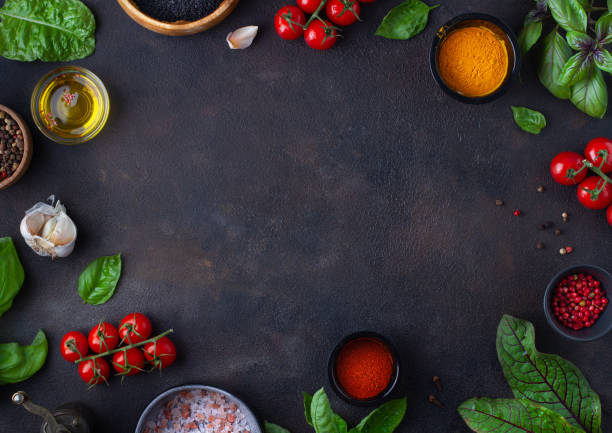 istock Frame of tomatoes, basil and spices, copy space 1409499371