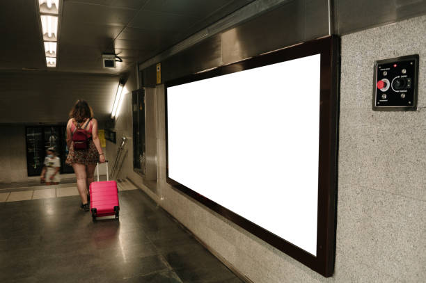 istock Young woman with face mask on a moving walkway 1409499494