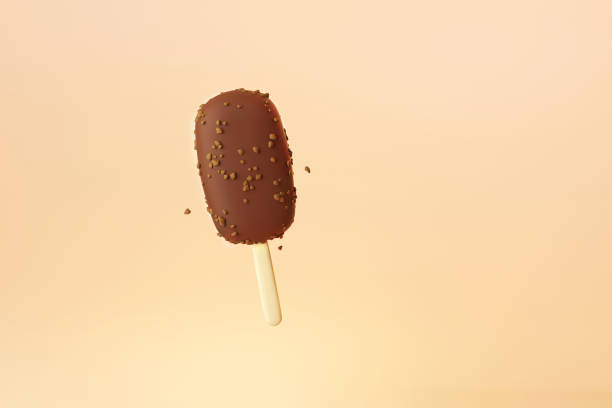 istock flying Ice cream chocolate stick with almonds on yellow background 1409499875