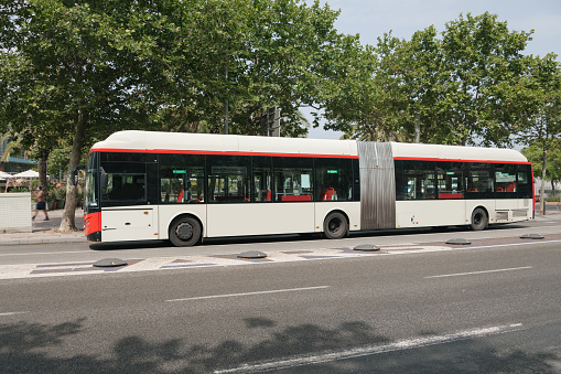 A modern articulated city bus in an urban area