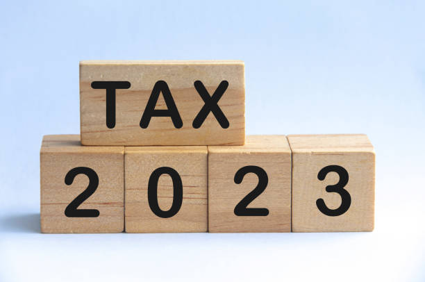 istock Tax 2023 text on wooden blocks with white background. 1409500000