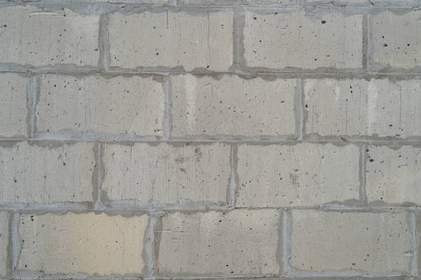 istock background texture of white Lightweight Concrete block, raw material for industrial wall 1409501273