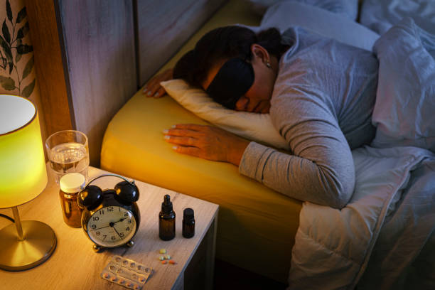 istock Woman suffering insomnia sleeping with eye mask 1409501881