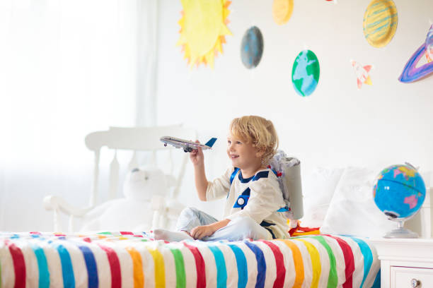 istock Kids play astronaut. Space and planet child game. 1409503125
