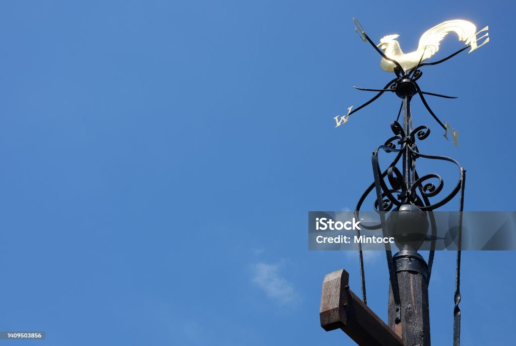 A rooster weathervane under the sky A photo taken in Oxford, UK Blue Stock Photo