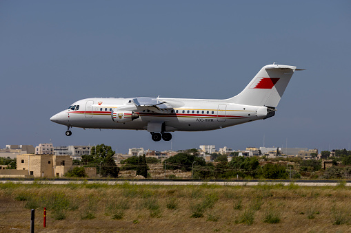 Luqa, Malta - July 8, 2022: Bahrain Air Force British Aerospace Avro 146-RJ85 (REG: A9C-HWR) coming in to land on runway 31.