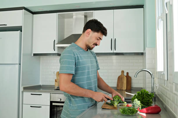 istock Man preparing a healthy meal. 1409505961