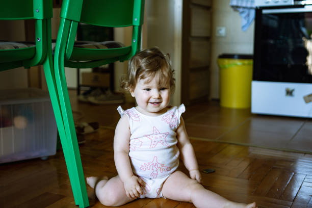 Cute baby girl playing at home