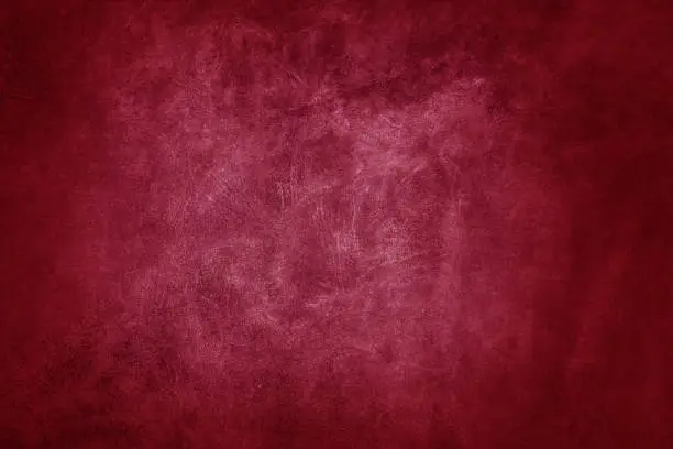 Photo of Beautiful red background with leather texture with red veins of red leather as sample of red background from natural leather or sample of texture of leather