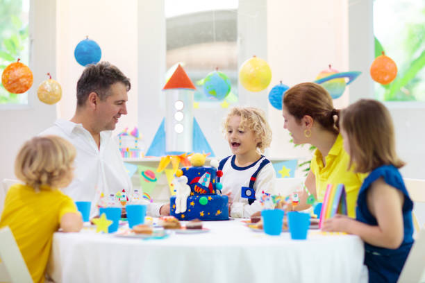 istock Kids space theme birthday party with cake. 1409512048