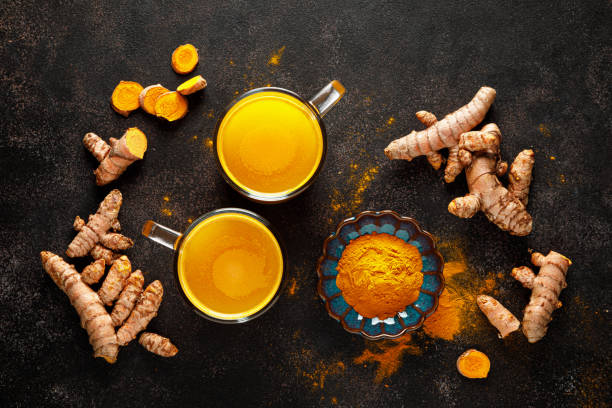 Turmeric. Fresh turmeric root and turmeric, curcumin powder Turmeric. Fresh turmeric root and turmeric, curcumin powder anti inflammatory stock pictures, royalty-free photos & images