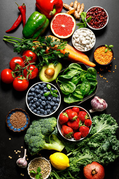 健康食品。健康的な食事の背景。果物、野菜、ベリー。 ベジタリアン食。スーパーフード - スーパーフード ストックフォトと画像