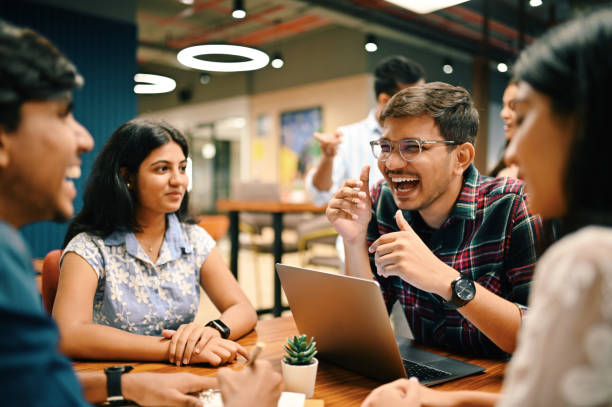 istock Group of young people discussing in the co-working office 1409520361
