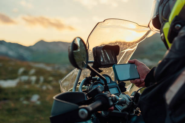 Biker with safety helmet searching global positioning system
