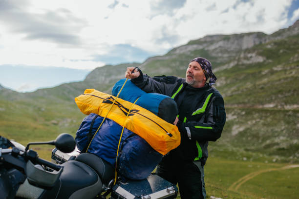 istock Unpacking stuff. It's time for the rest in the mountain 1409525433