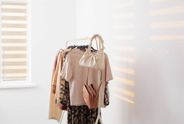 istock female beige capsule summer wardrobe in  white room 1409527624