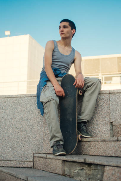 istock Portrait of a cool young man with skateboard 1409527723