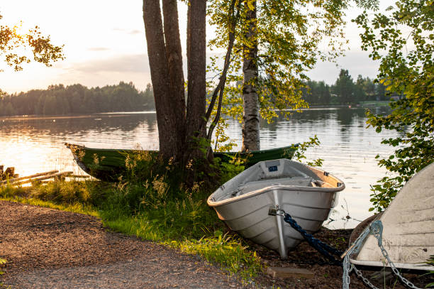 Row boats pepper the shorelines across Tampere Finland
