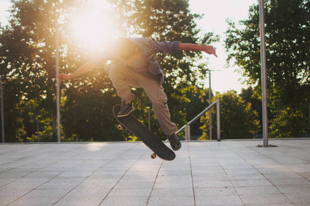 istock Skateboarder doing skateboarding trick ollie on city 1409529050