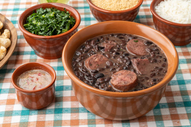 istock Typical brazilian feijoada with rice, caipirinha, farofa and cracklings 1409529282