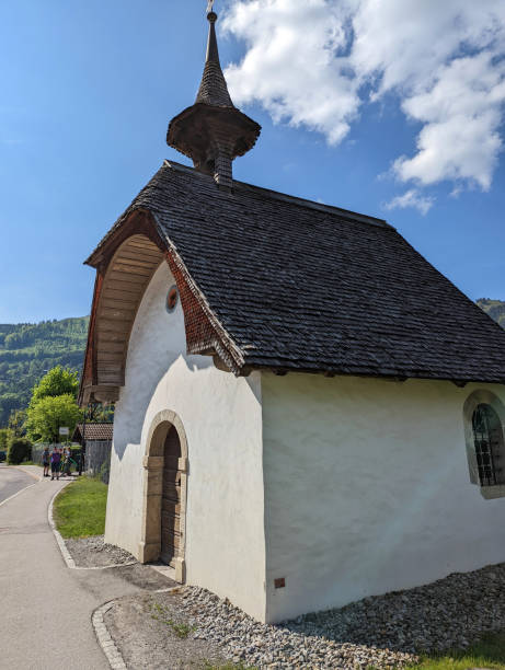 Small roadside chapel in mountain farm village near Bulle in the district of gruyere and the Fribourg Canton  of Switzerland Small roadside chapel in mountain farm village near Bulle in the district of gruyere and the Fribourg Canton  of Switzerland bulle stock pictures, royalty-free photos & images