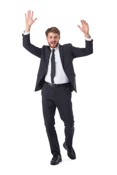 Business man wearing black suit posing with hands up winner concept srudio isolated on white