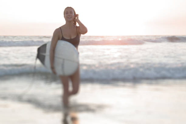 Woman at Beach after Surfing in Costa Rica stock photo