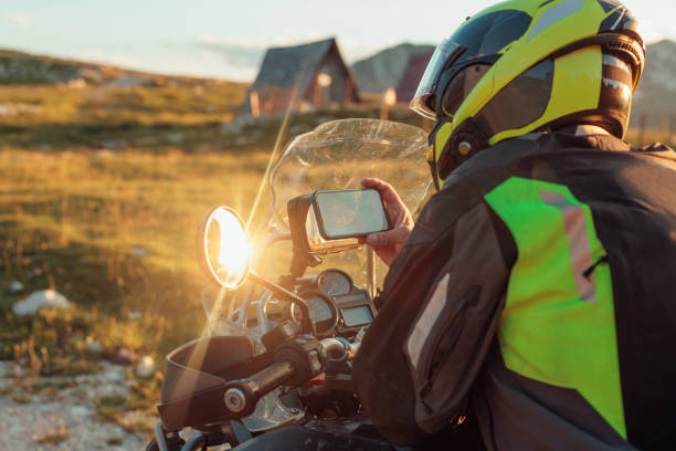 istock Motorcyclist adjusting the navigation on mobile phone 1409531265