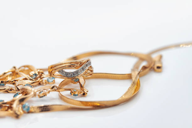 istock A gold chain with a pendant and a Topaz ring 1409532836