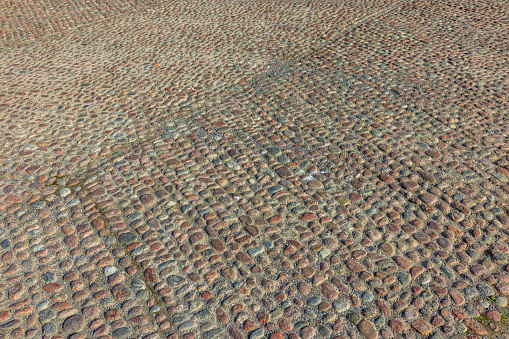 Beautiful looking texture on paving slabs. Gray background, pattern. Sweden.