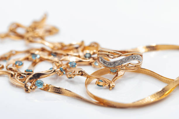 istock A gold chain with a pendant and a Topaz ring 1409537132