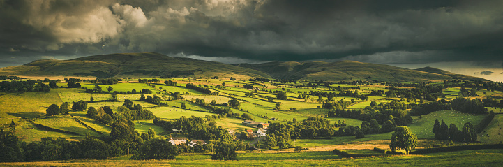 The rolling Northern Fells of the English Lake District seen from above the hamlet of Whelpo Bridge.