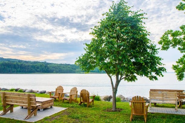 istock Wooden benches in front of St. Lawrence river 1409538058