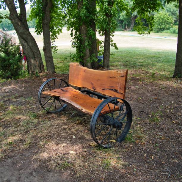 istock Rustic Wooden Bench with Wagon Wheels in Kansas 1409541442