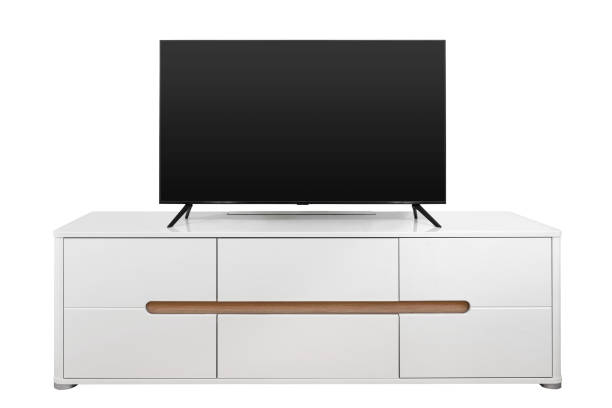 istock Flat screen TV on a white nightstand isolated on a white background 1409544121
